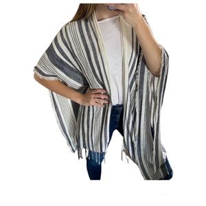 Aerie lightweight shawl with fringe accent.